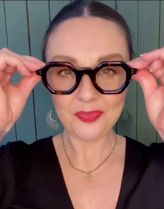 Hexagonal geometric reading glasses in tortoiseshell on a stylish woman – Ministry of Sight