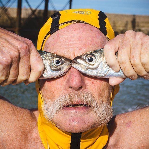 Man with fish on eyes you need reading glasses