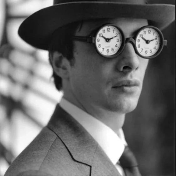 Man in suit with clock glasses