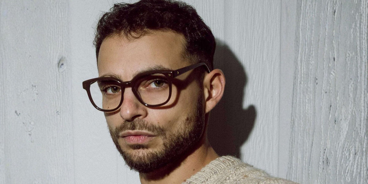 Stylish Australian man wearing tortoiseshell reading glasses