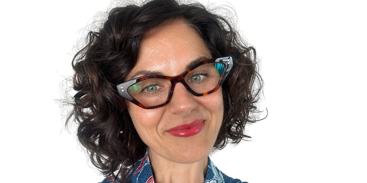 Australian woman wearing stylish tortoiseshell reading glasses