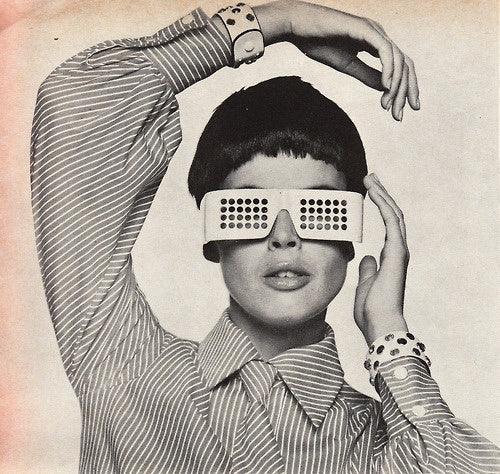 Woman with trendy glasses and short hair