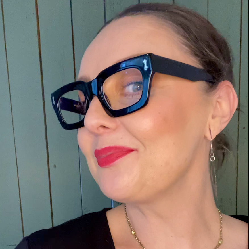 Australian woman wearing stylish black square reading glasses