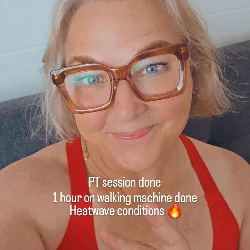 Australian woman with blonde hair and blue eyes wearing cool taupe pink neutral square reading glasses in red tank top Ministry of Sight