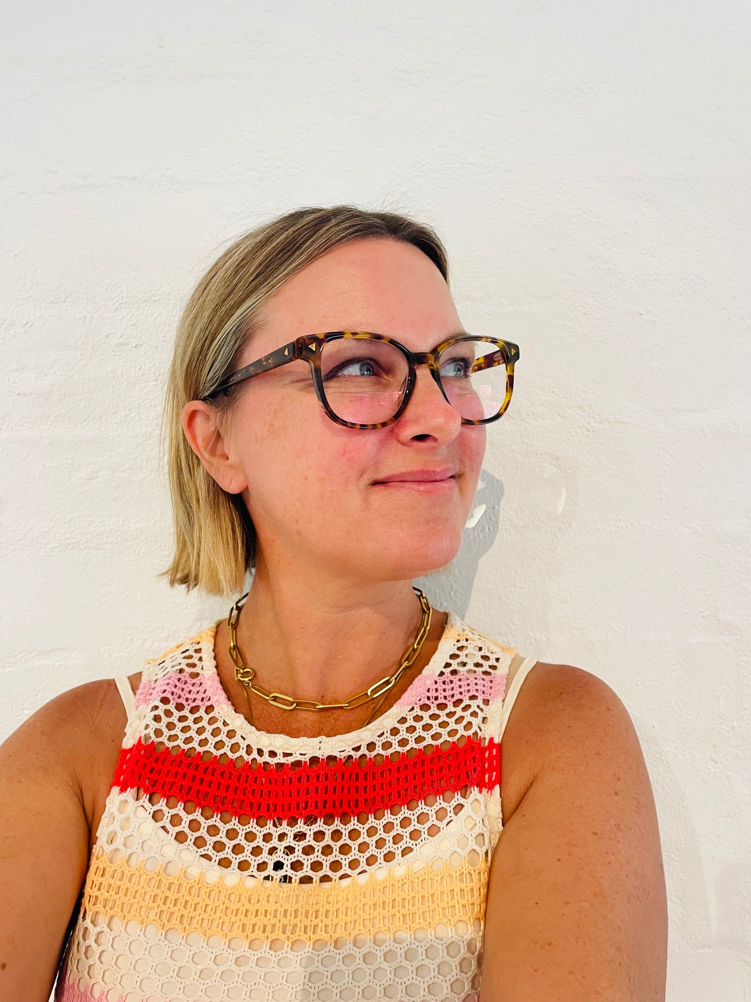 Australian woman wearing stylish round vintage tortoiseshell reading glasses