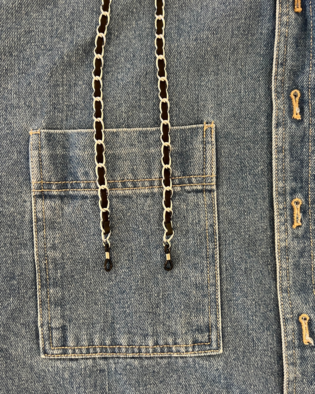 Interwoven metal and fabric chanel inspired glasses chain with stylish round oversized readers from Ministry of Sight on denim jacket