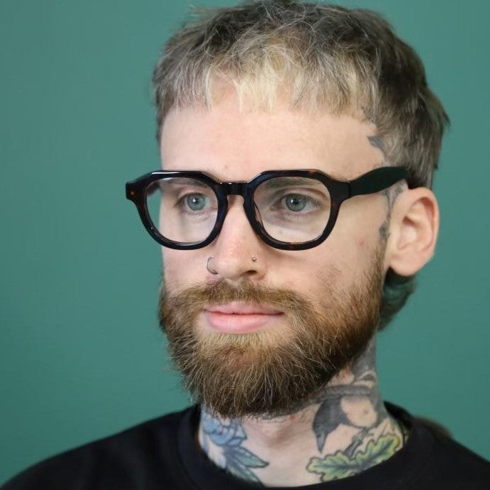 Australian Man with tattoos wearing flat top tortoiseshell reading glasses from ministry of sight
