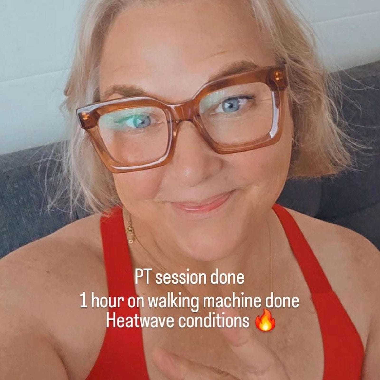 Australian woman with blonde hair and blue eyes wearing cool taupe pink neutral square reading glasses in red tank top Ministry of Sight