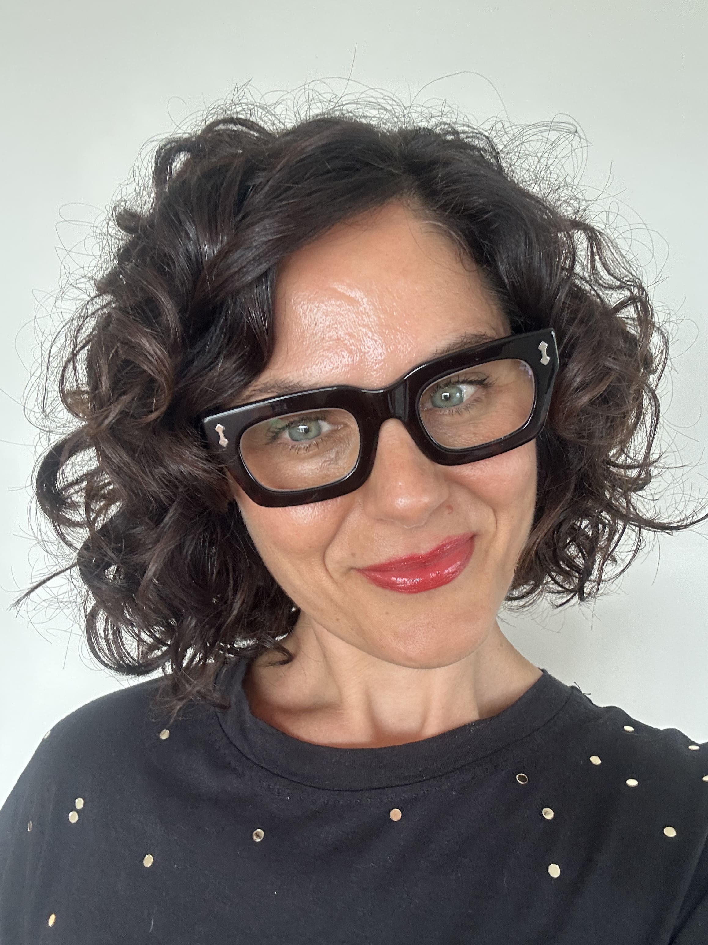 Australian woman wearing tort rectangular readers - ministry of sight reading glasses +1.0 blue-light blocking lenses