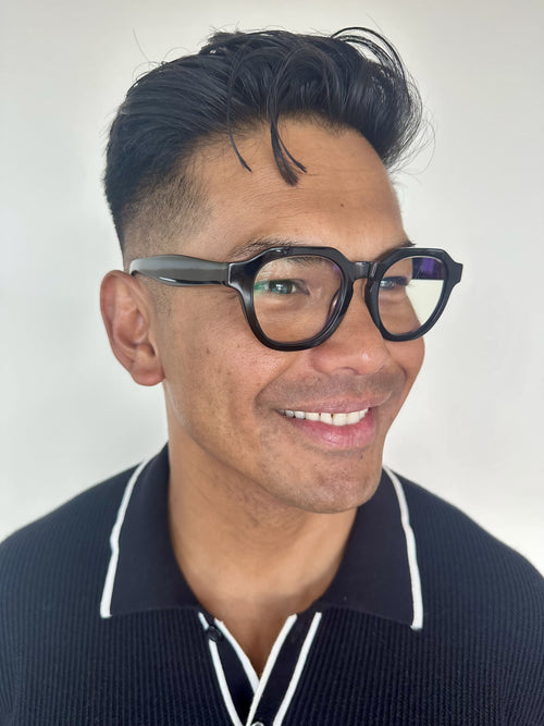Australian man in a black top wearing The Flat Top black reading glasses  - ministry of sight readers
