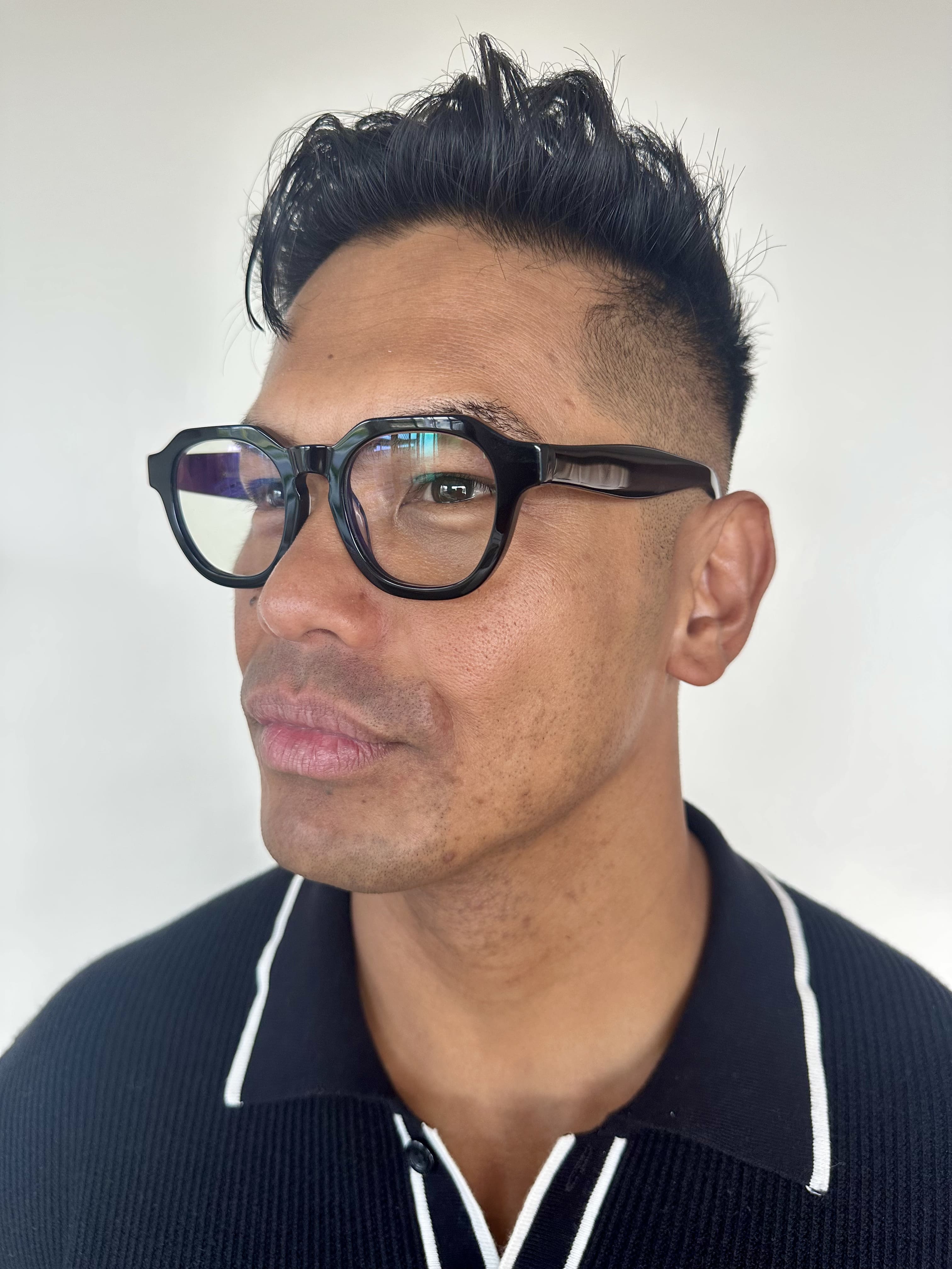 Australian man in a black top wearing The Flat Top black reading glasses  - ministry of sight readers