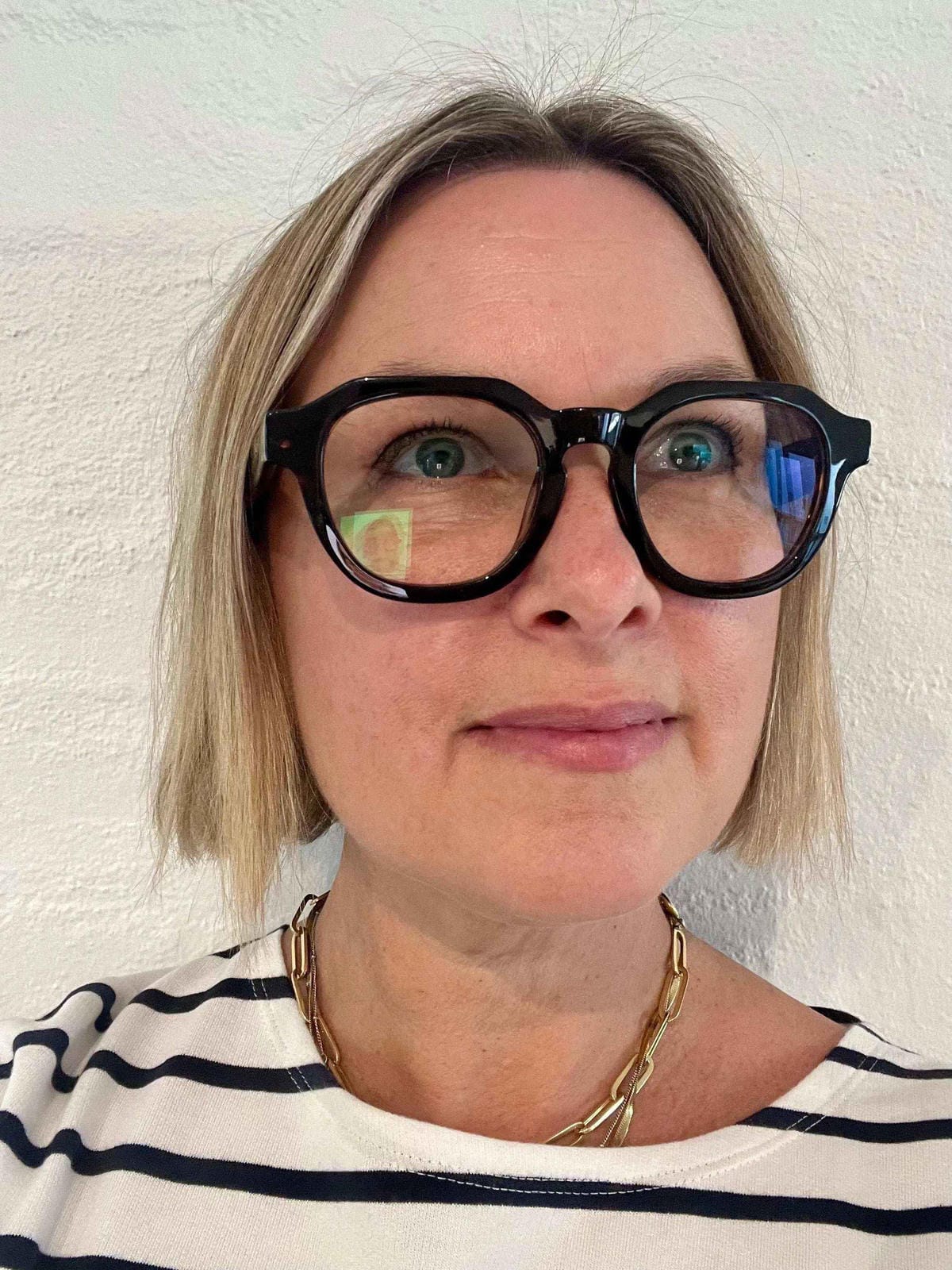 blonde woman wearing black flat top readers - ministry of sight reading glasses +2.0