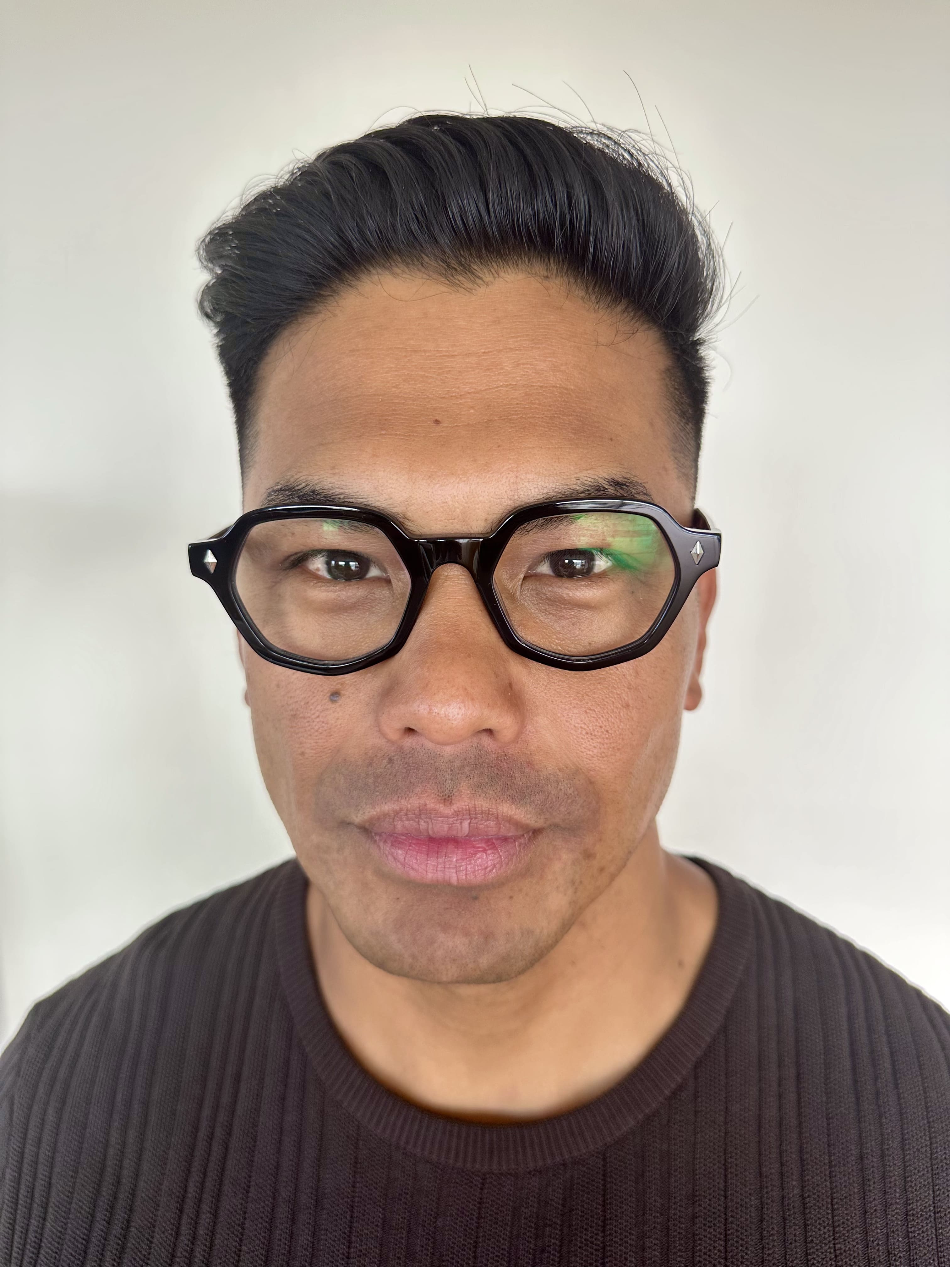 Australian man wearing The Heptagon reading glasses. Geometric brown and black reading glasses - ministry of sight readers