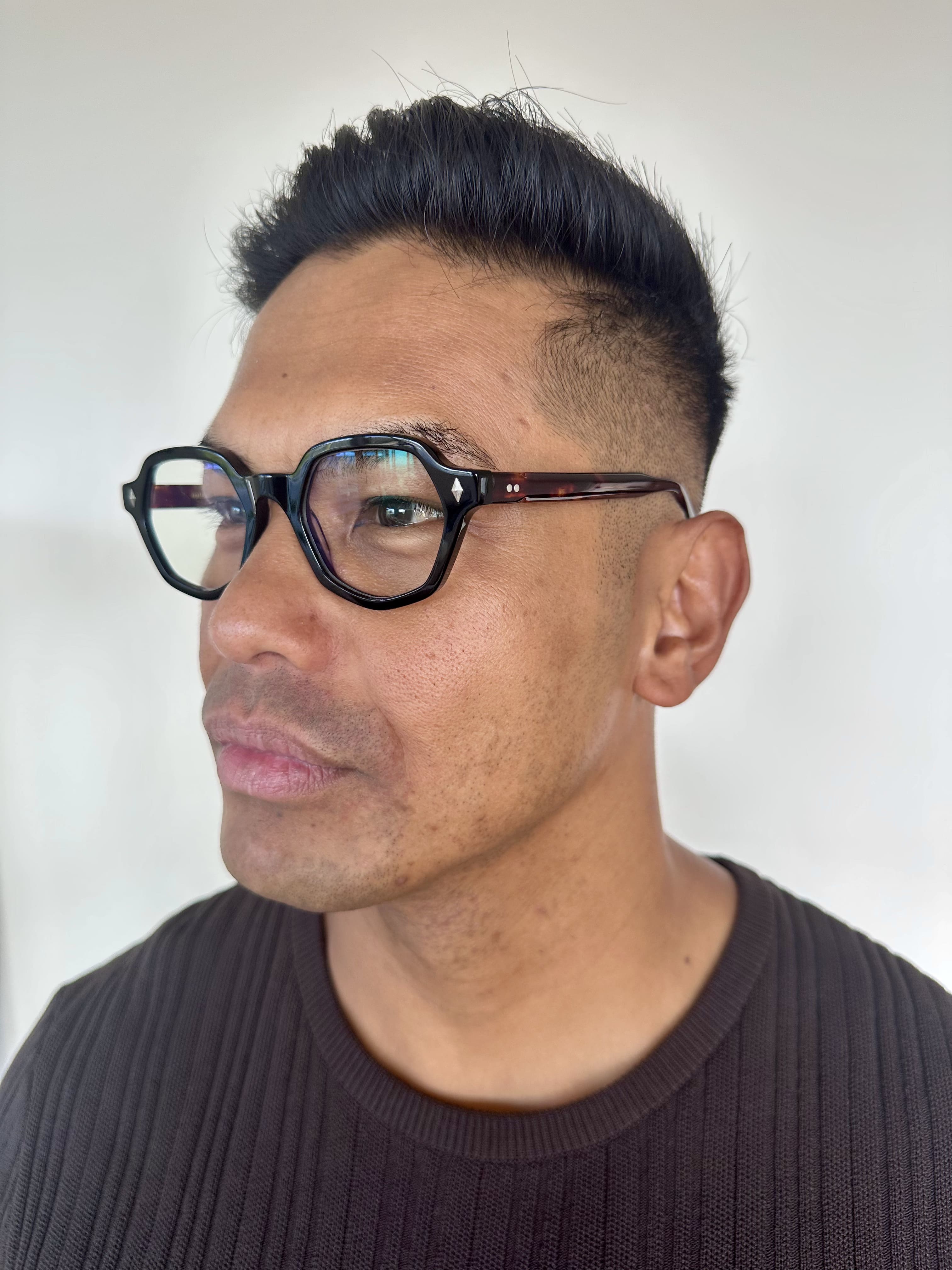 Australian man wearing The Heptagon reading glasses. Geometric brown and black reading glasses - ministry of sight readers