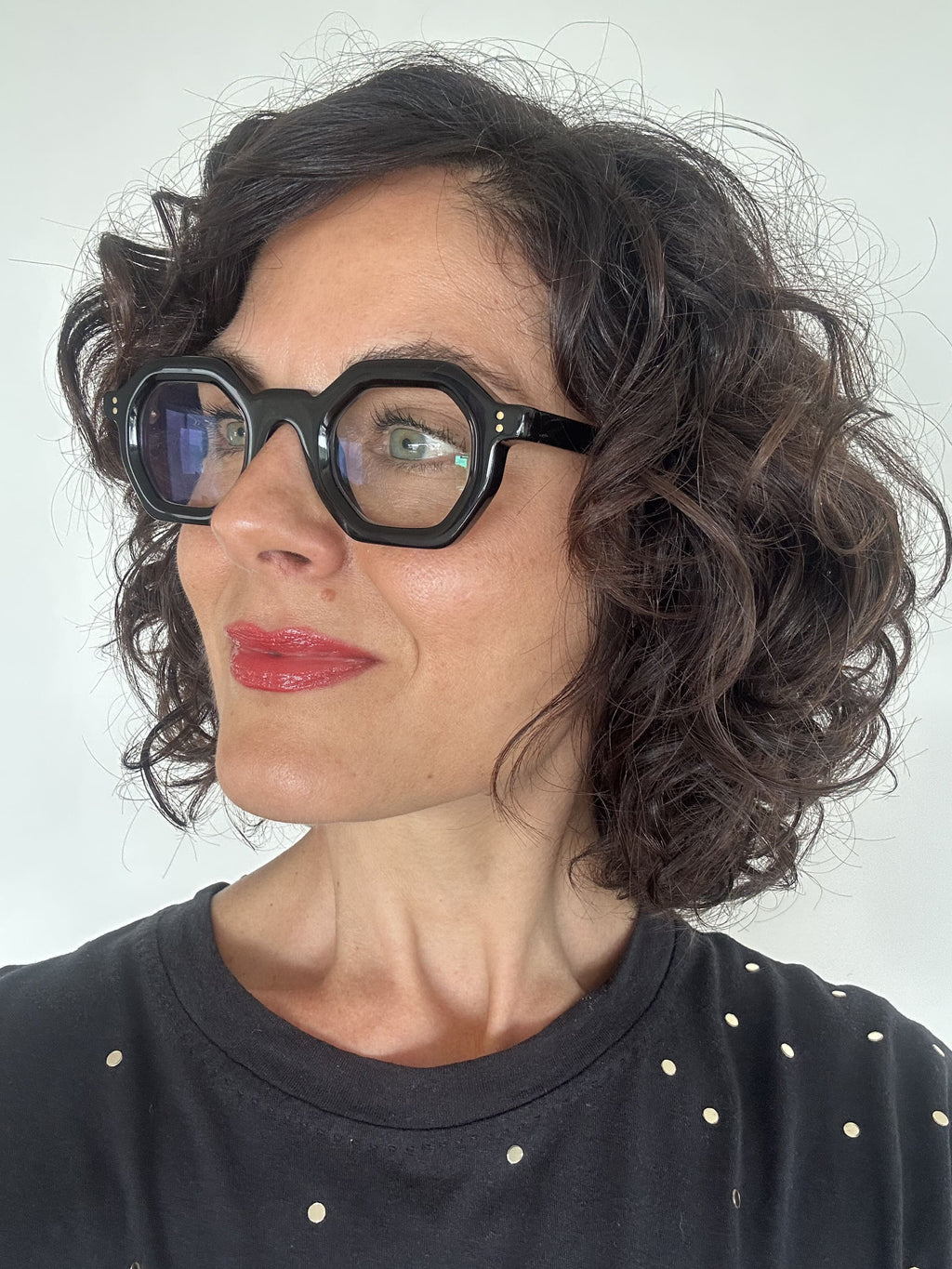 Over 40s woman wearing flattering reading glasses - geometric, black acetate frame - ministry of sight - readers