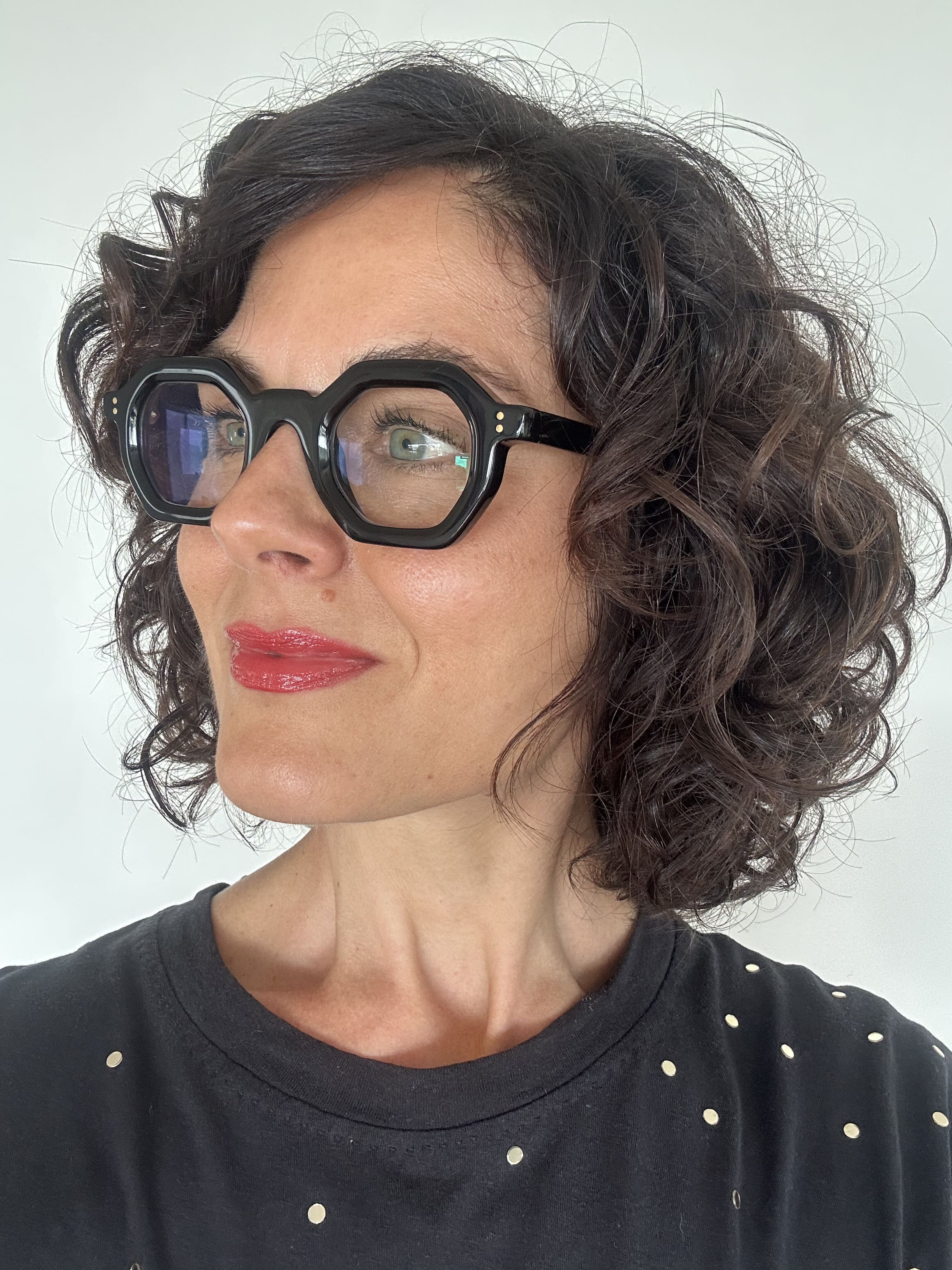 Over 40s woman wearing flattering reading glasses - geometric, black acetate frame - ministry of sight - readers