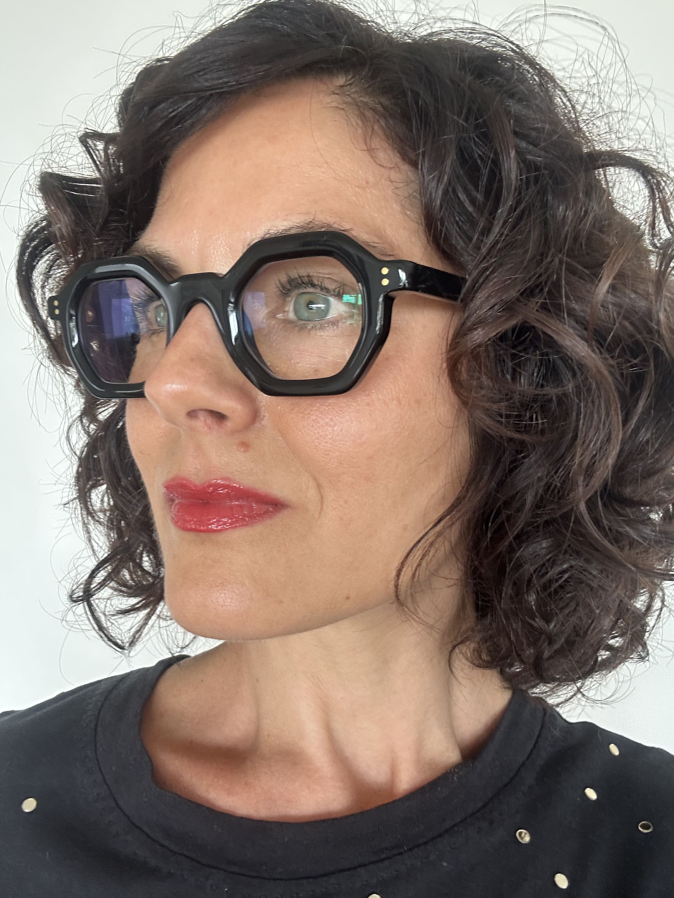 Over 40s woman wearing flattering reading glasses - geometric, black acetate frame - ministry of sight - readers