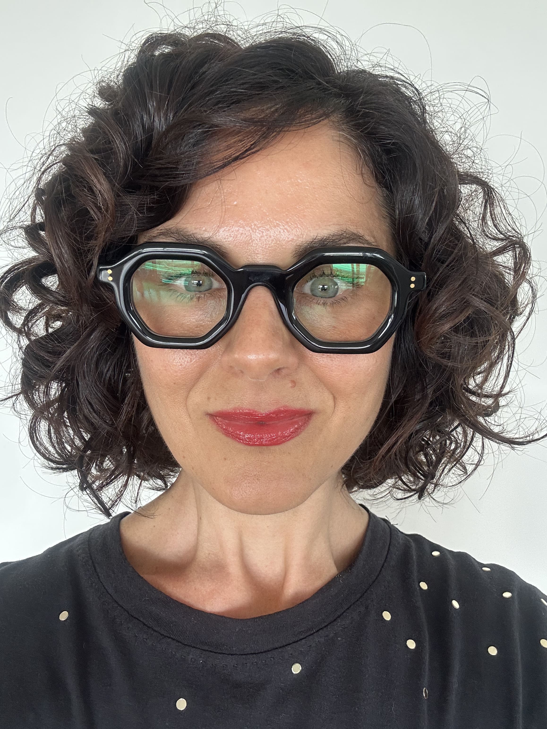 Over 40s woman wearing flattering reading glasses - geometric, black acetate frame - ministry of sight - readers