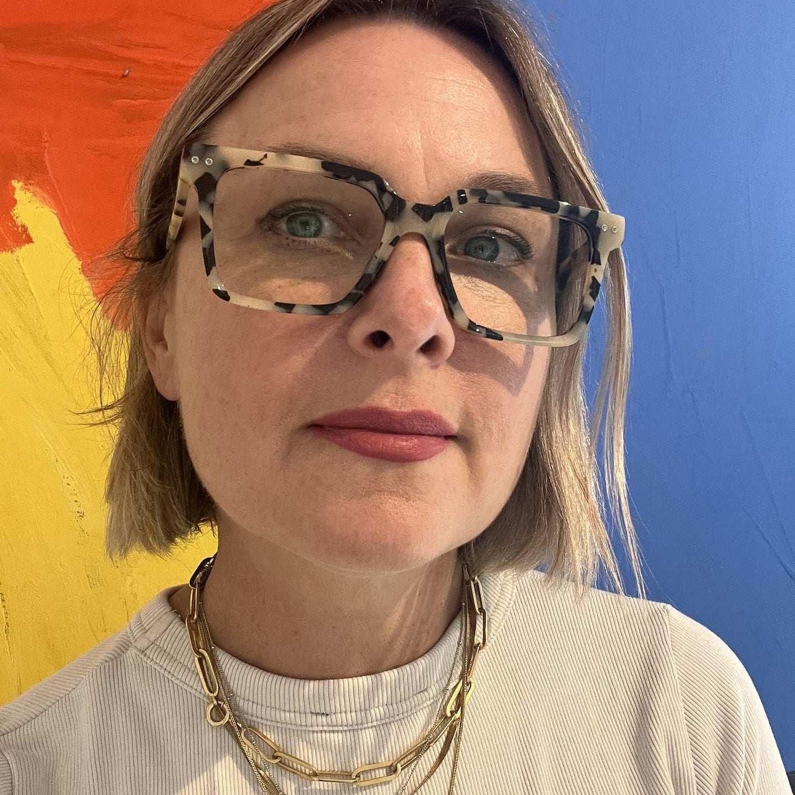 Australian woman wearing stylish white and black leopard reading glasses - Ministry of Sight