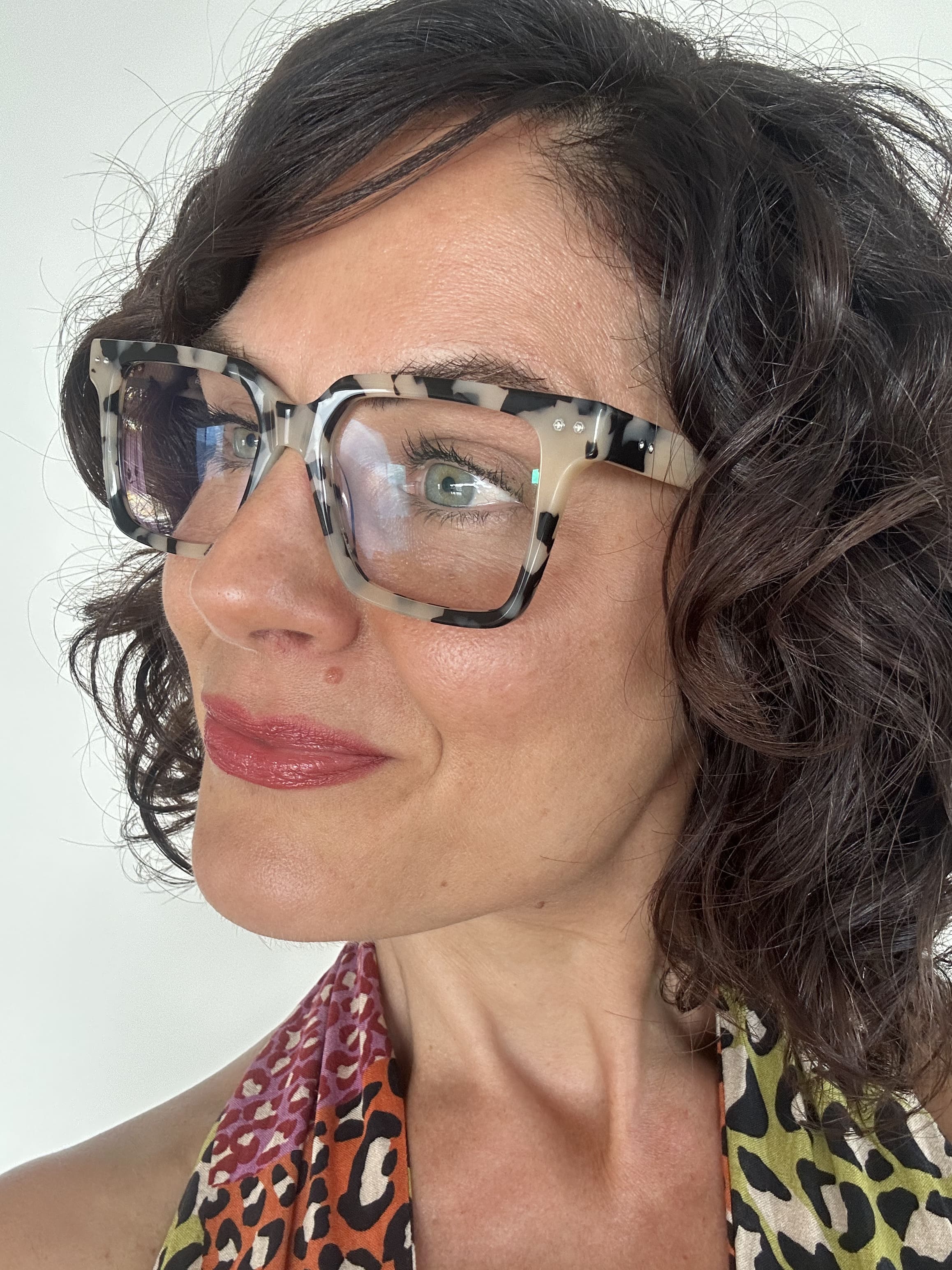 Stylish woman over 40 wearing premium blue light blocking tortoiseshell square Readers