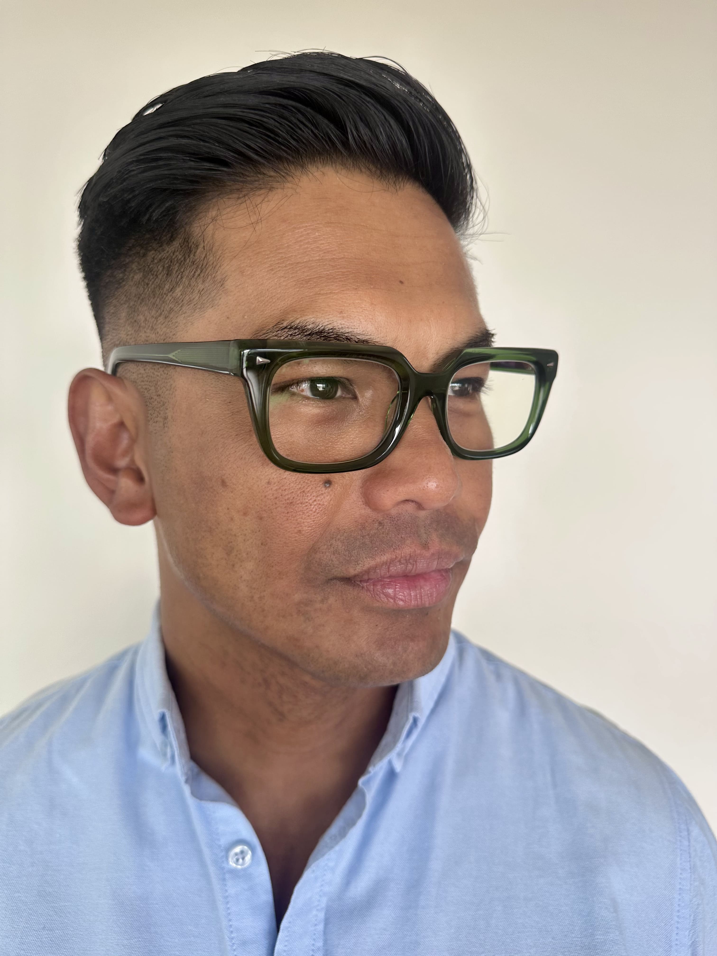 Stylish green reading glasses on an over 40s Australian man - Ministry of Sight readers