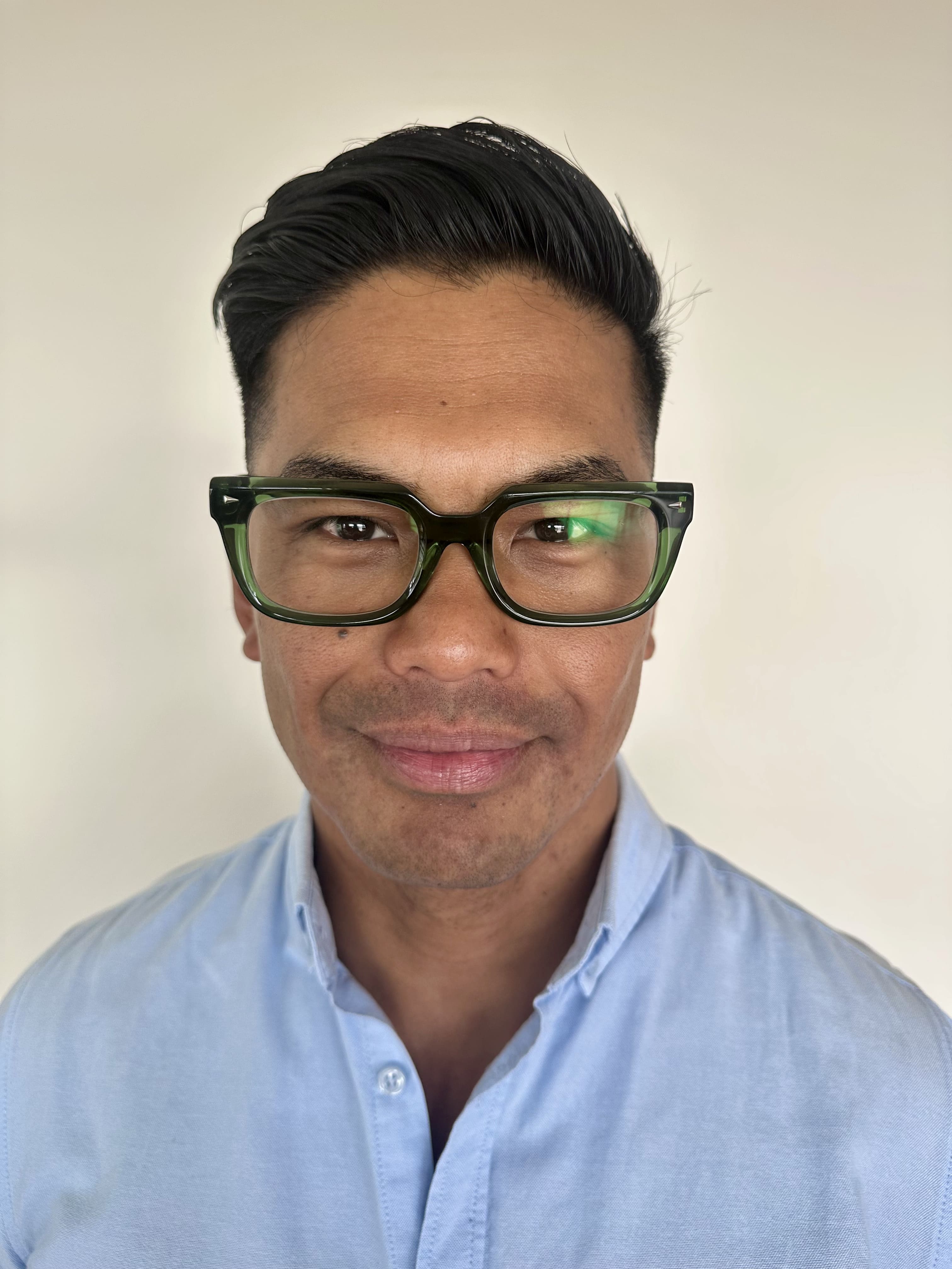 Stylish green reading glasses on an over 40s Australian man - Ministry of Sight readers