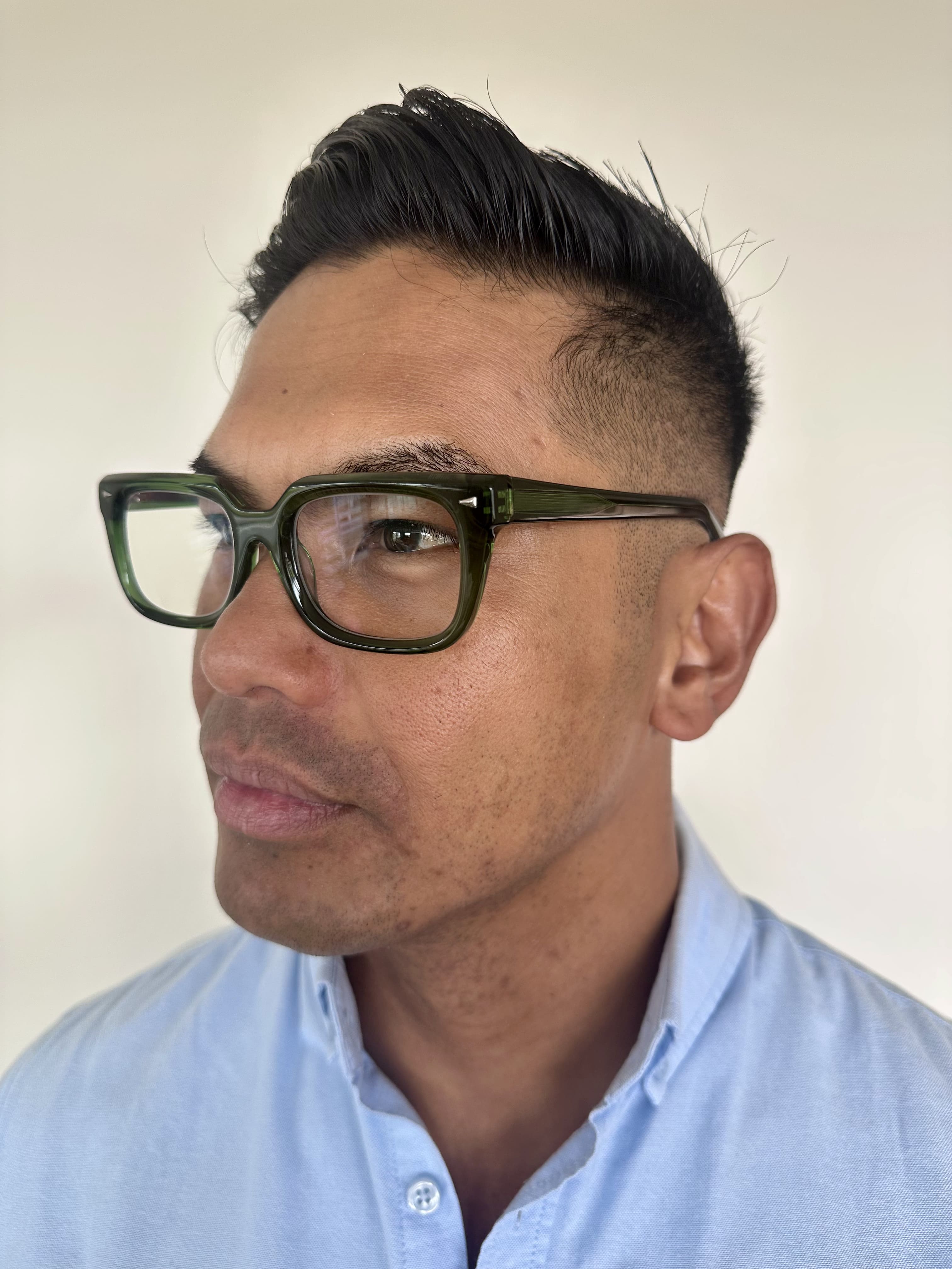 Stylish green reading glasses on an over 40s Australian man - Ministry of Sight readers