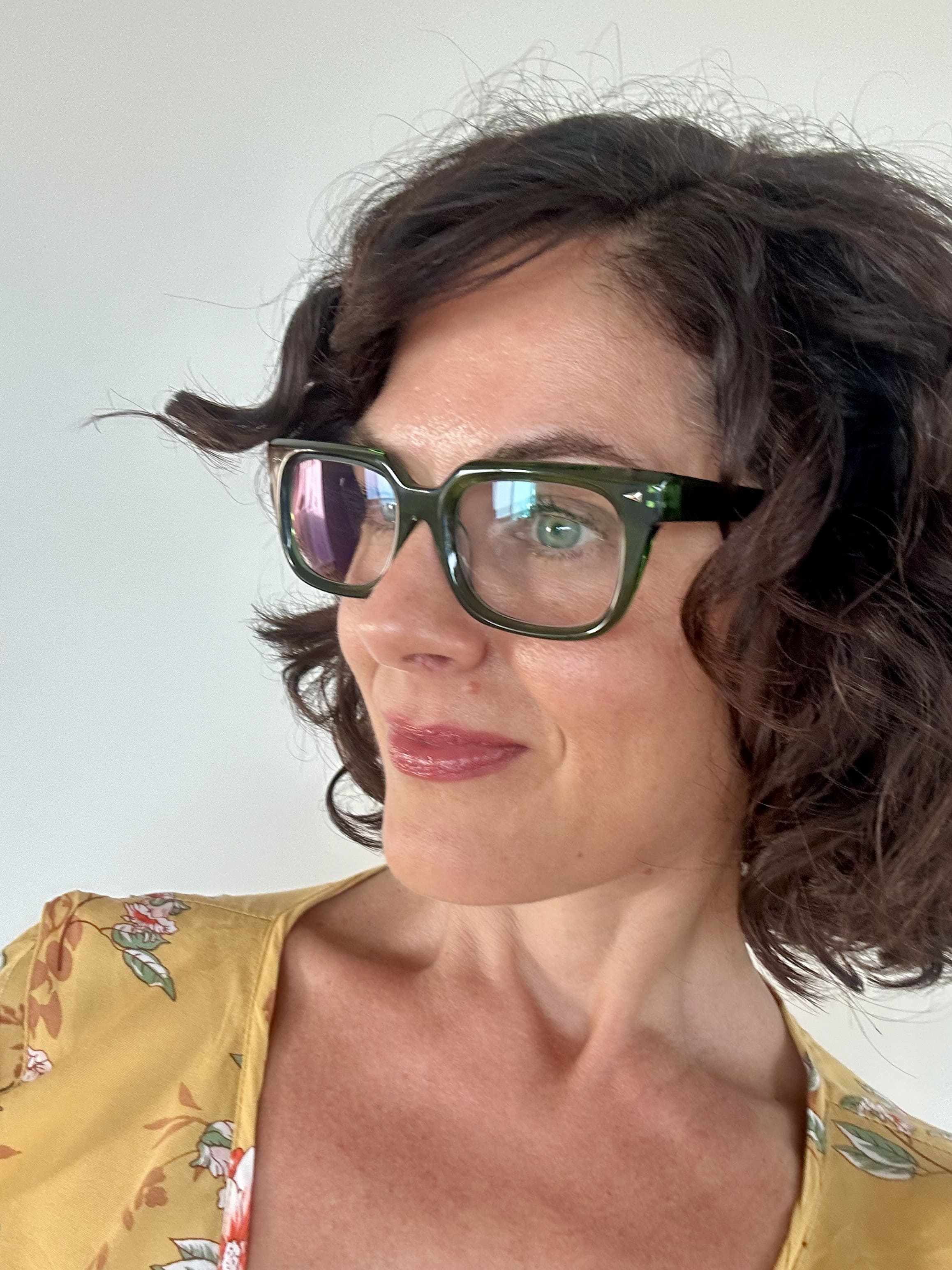 Fashionable green reading glasses on an over 40s Australian woman - Ministry of Sight readers
