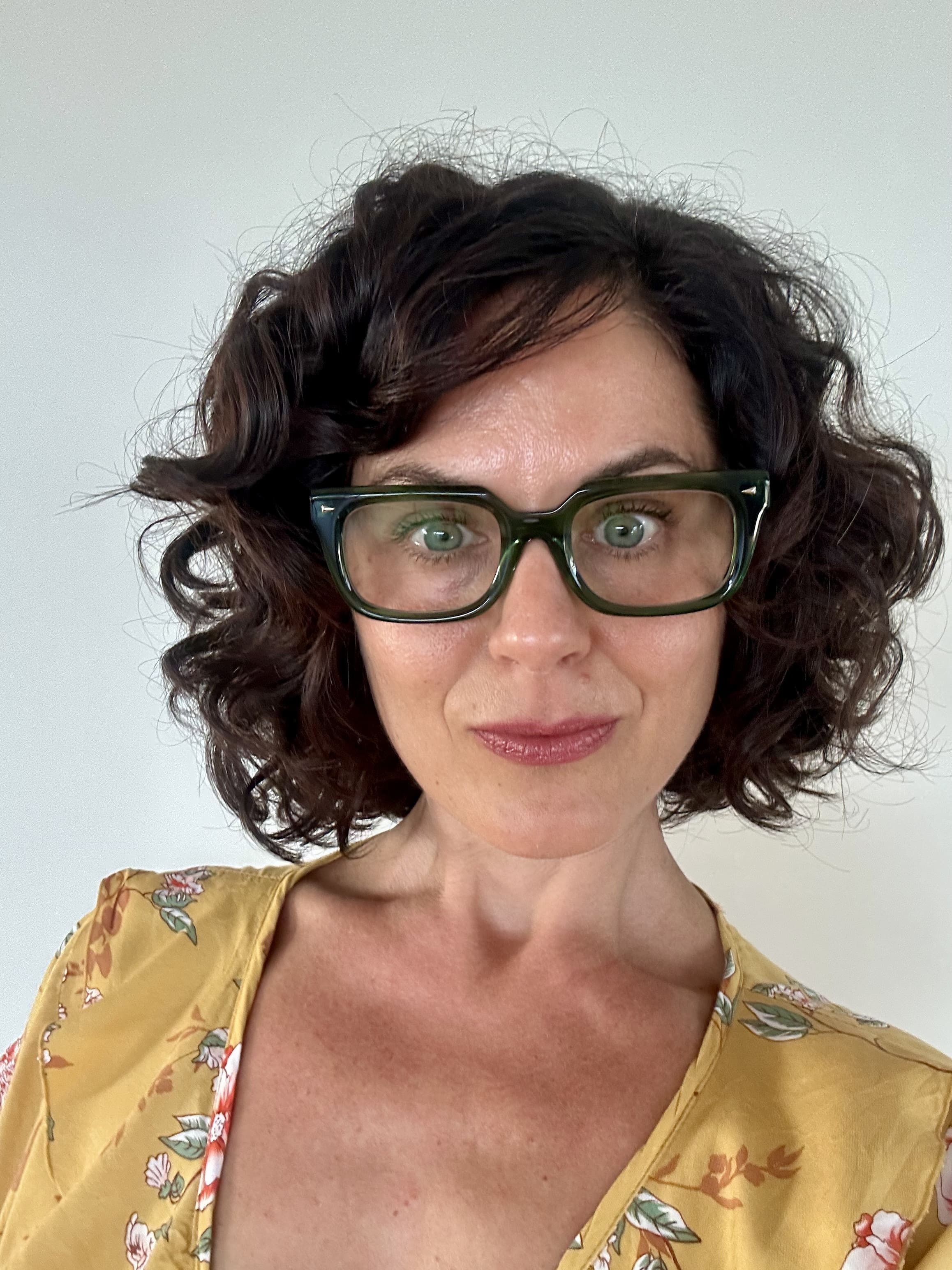 Fashionable green reading glasses on an over 40s Australian woman - Ministry of Sight readers