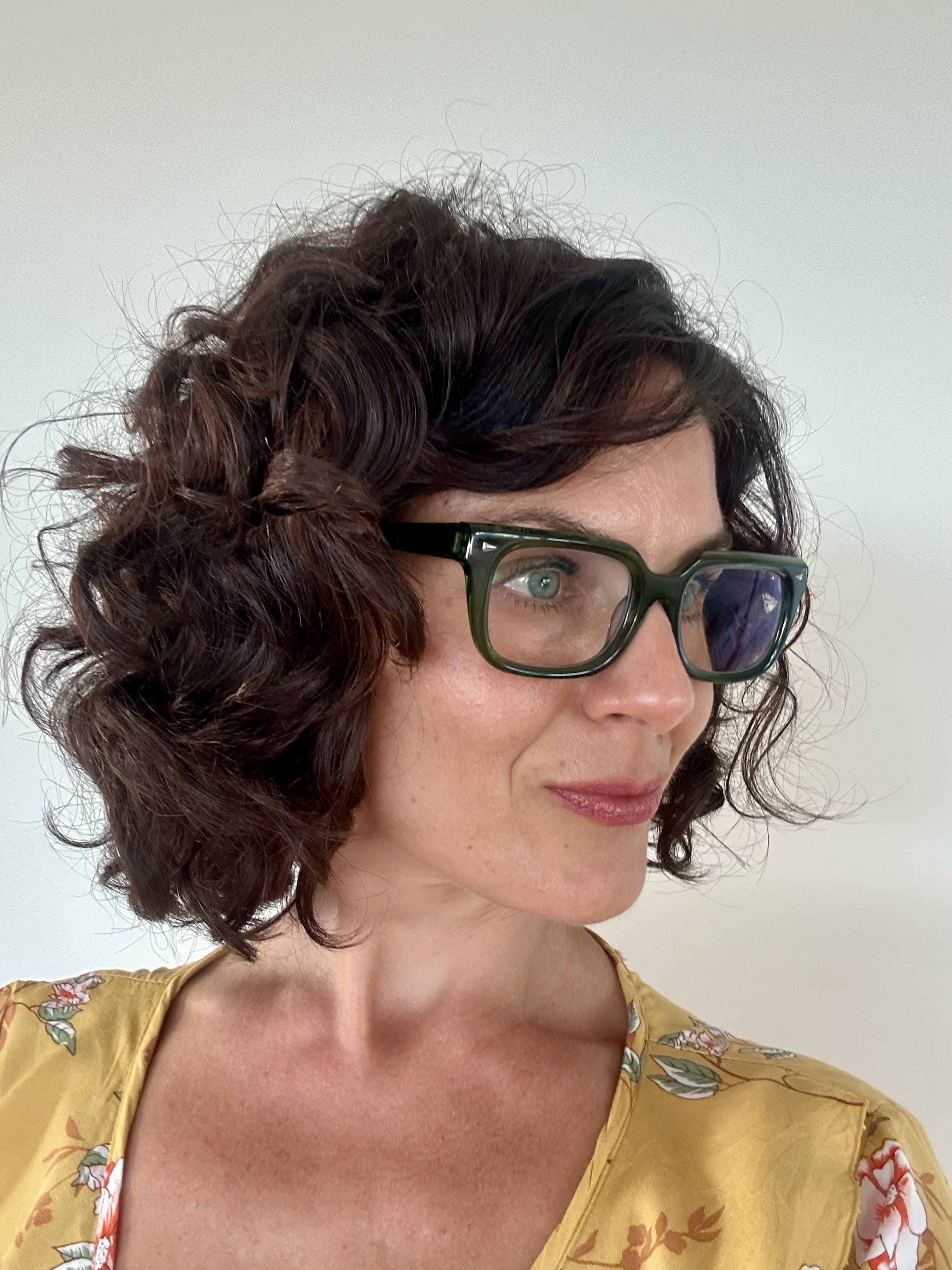 Fashionable green reading glasses on an over 40s Australian woman - Ministry of Sight readers