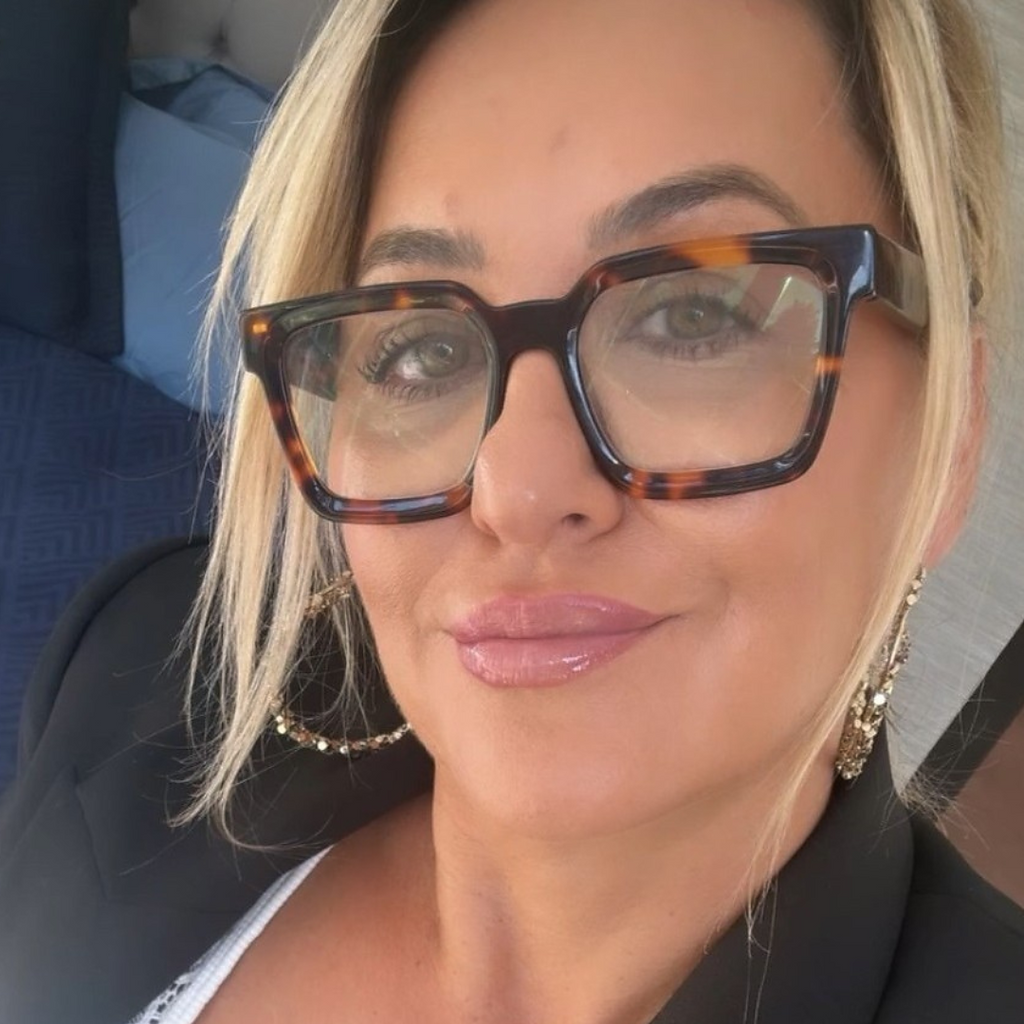 Australian Woman wearing stylish tortoiseshell square glasses in a suit and blazer with blond hair - ministry of sight readers