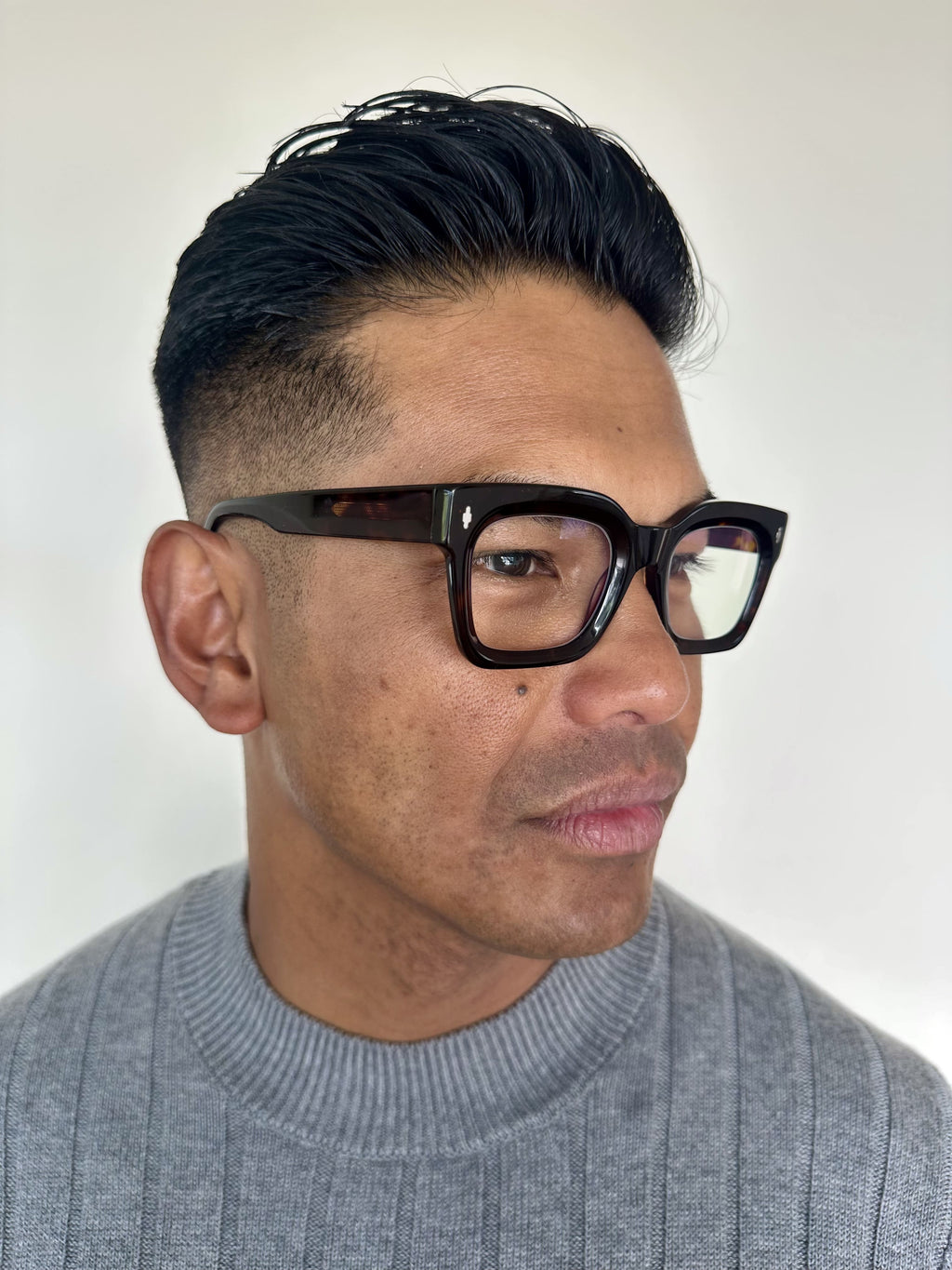 Man wearing classic readers ministry of sight reading glasses