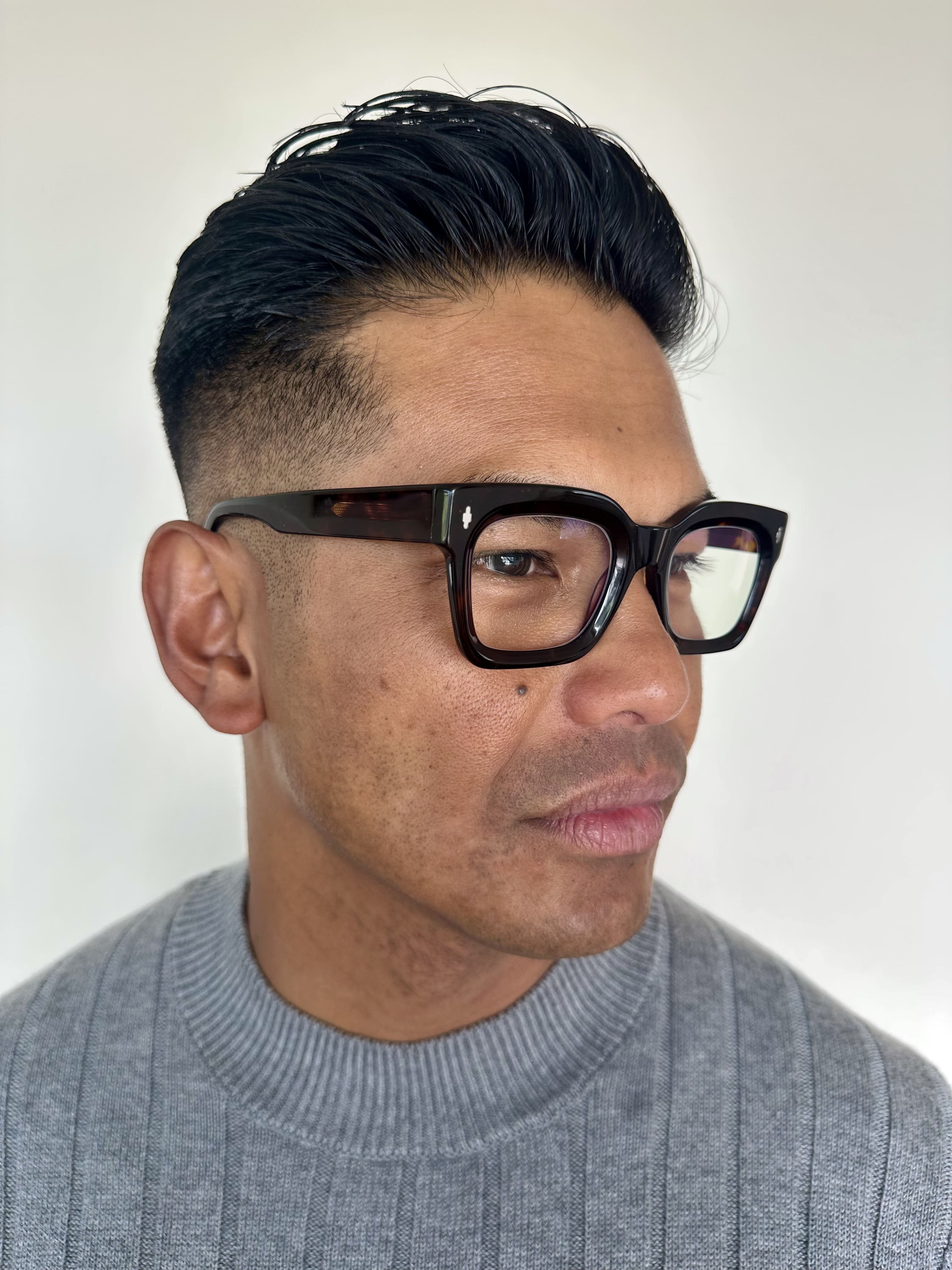 Man wearing classic readers ministry of sight reading glasses