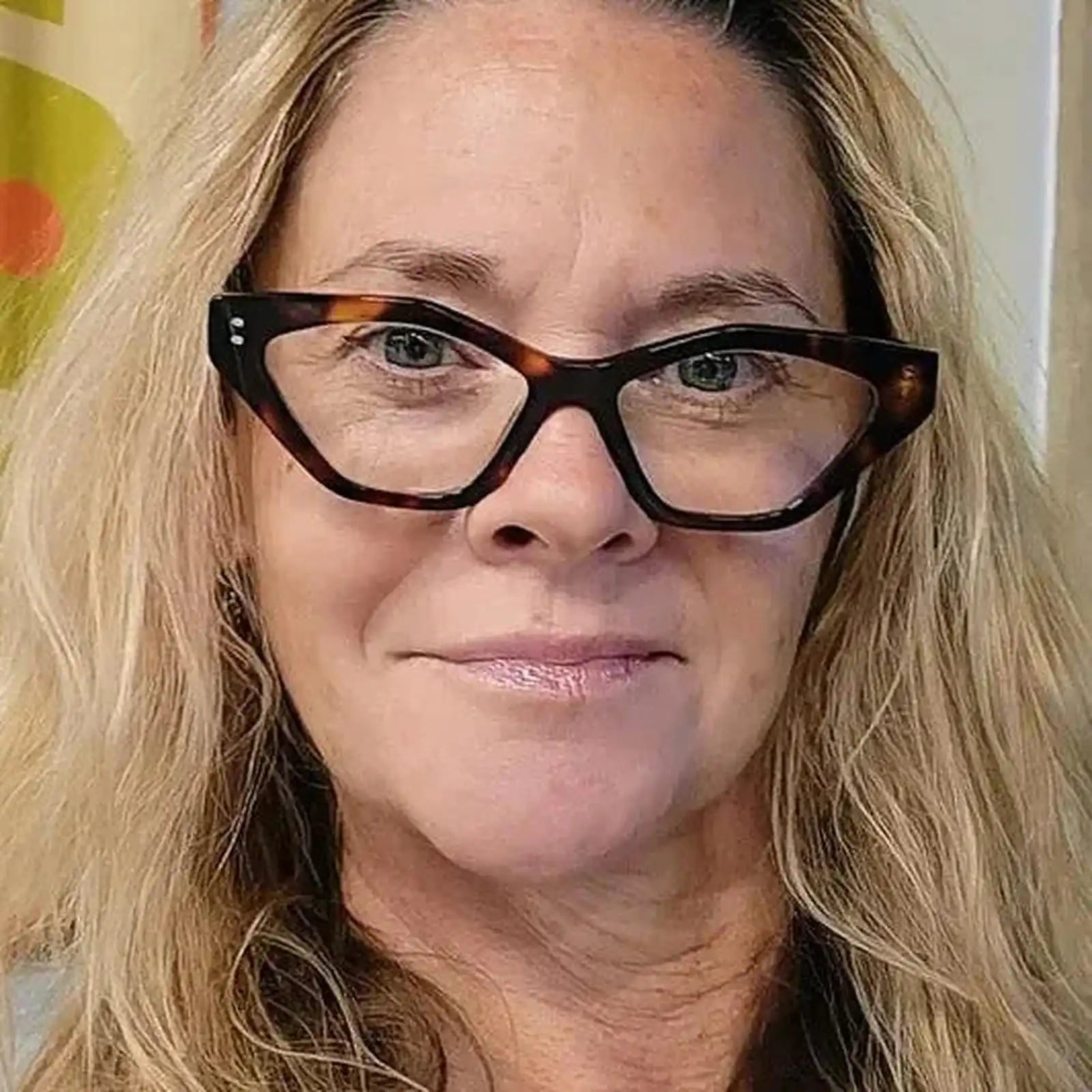 Woman over 60 wearing cat-eye tortoiseshell reading glasses - ministry of sight readers