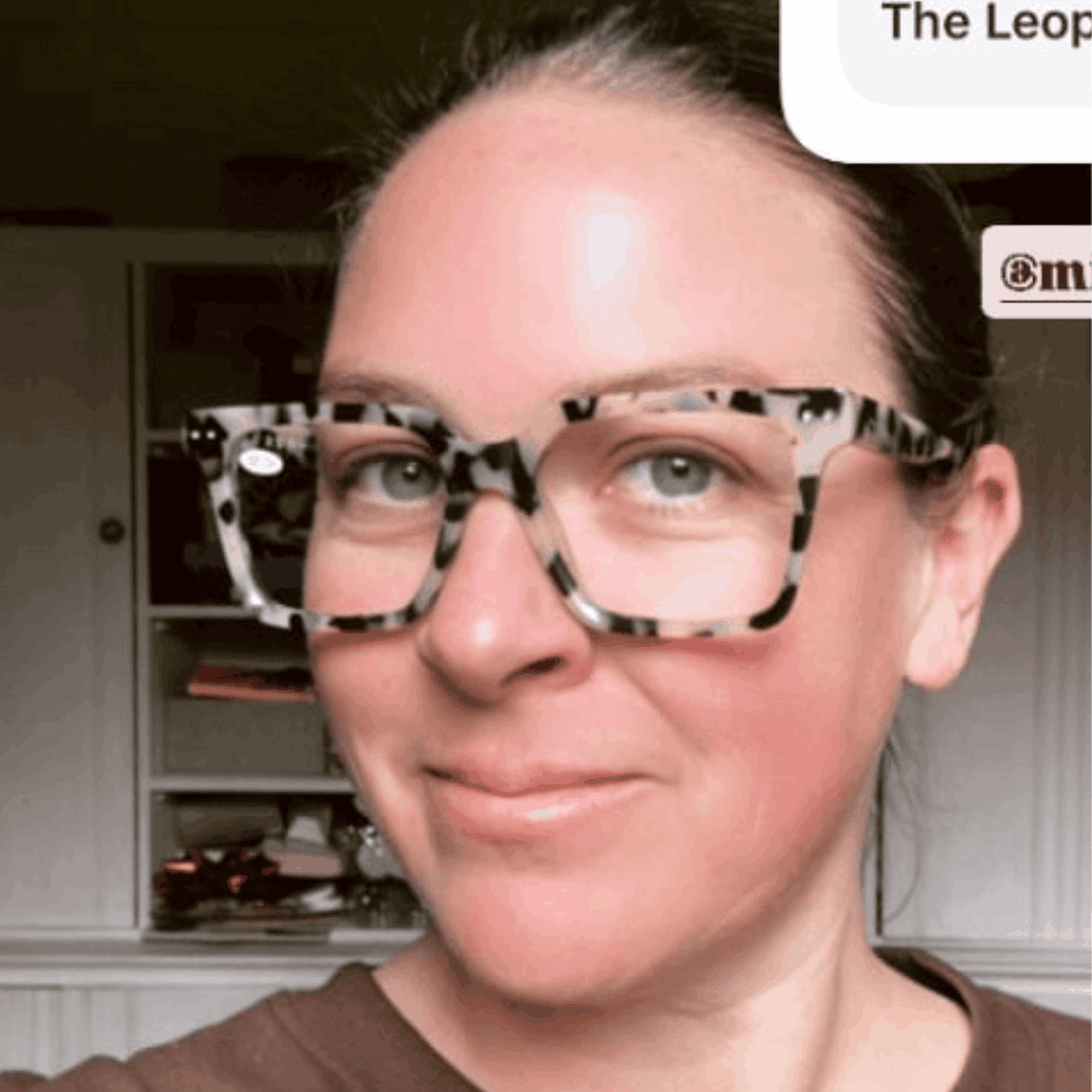 Australian woman wearing black and white leopard print reading glasses - Ministry of Sight