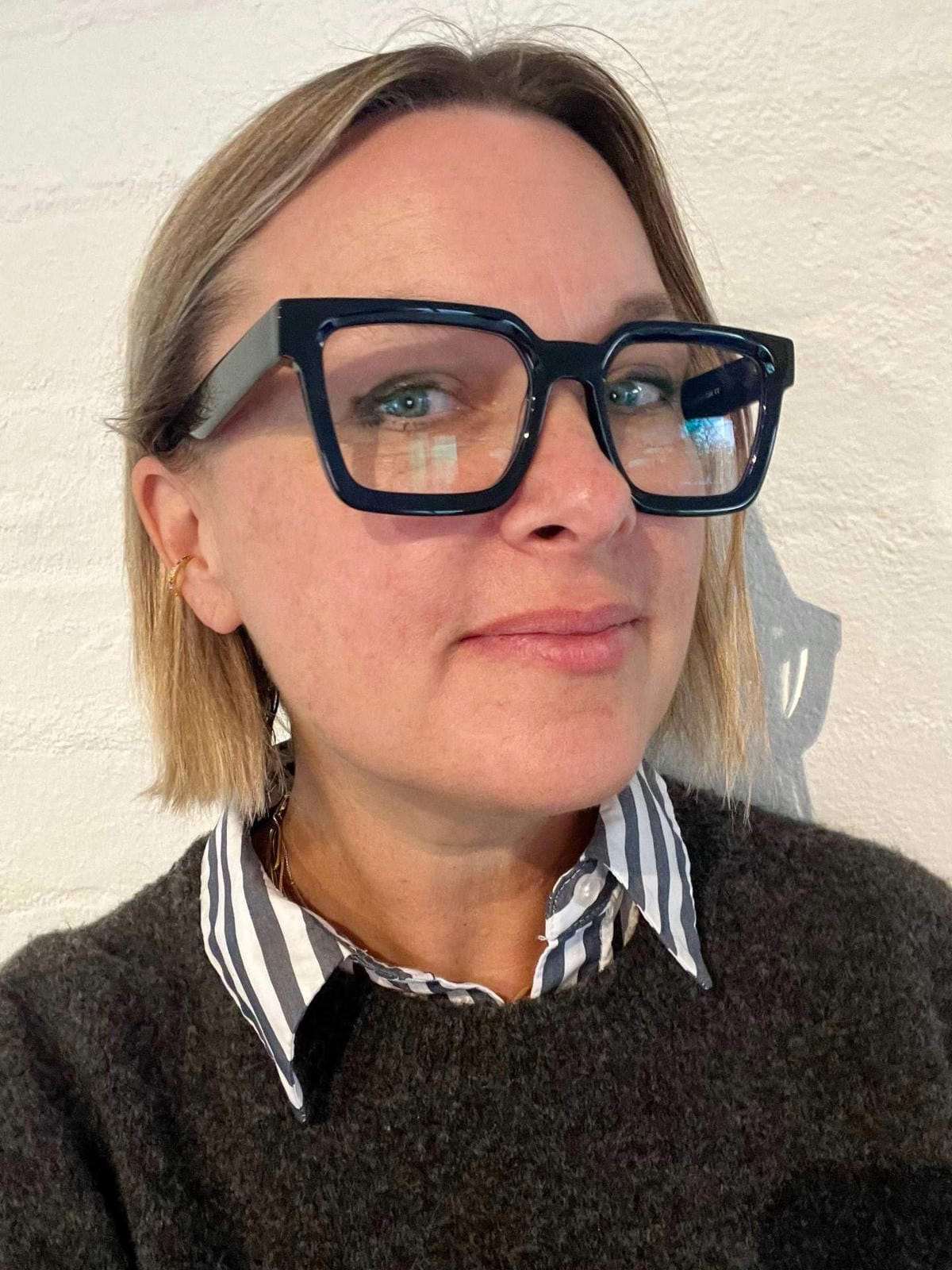 Australian woman wearing navy blue square reading glasses - Ministry of Sight - The Square readers